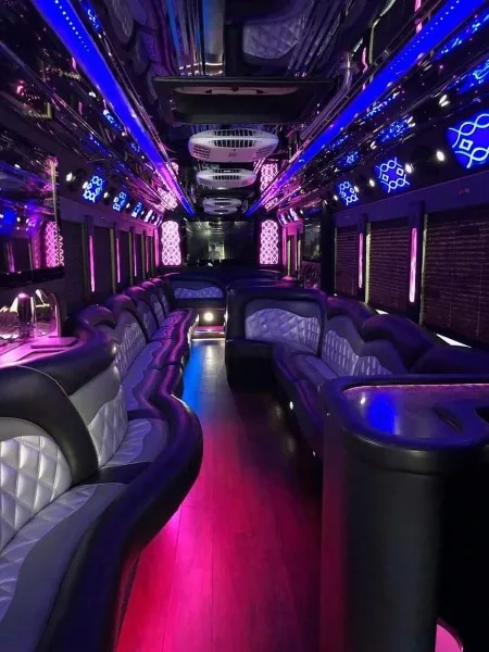 50-passenger party bus interior with wraparound leather seating