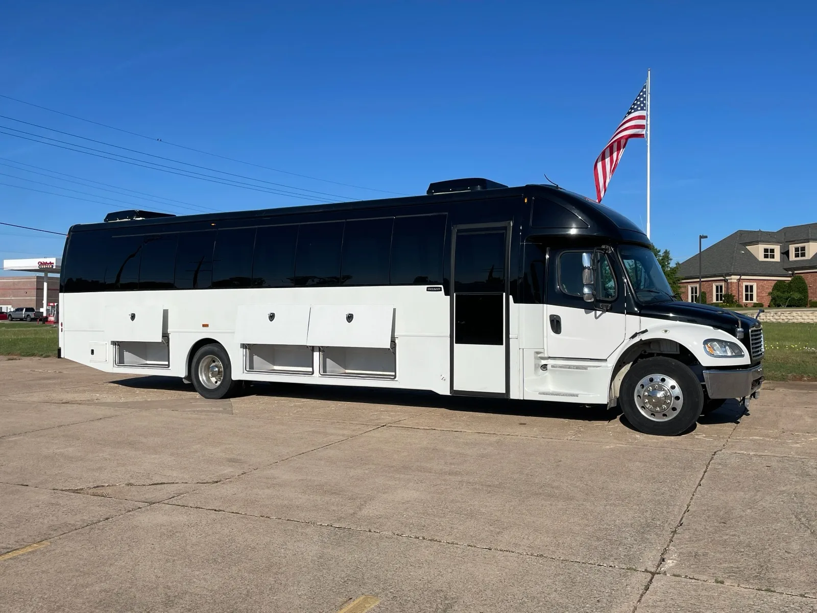 White and black motor coach party bus side view