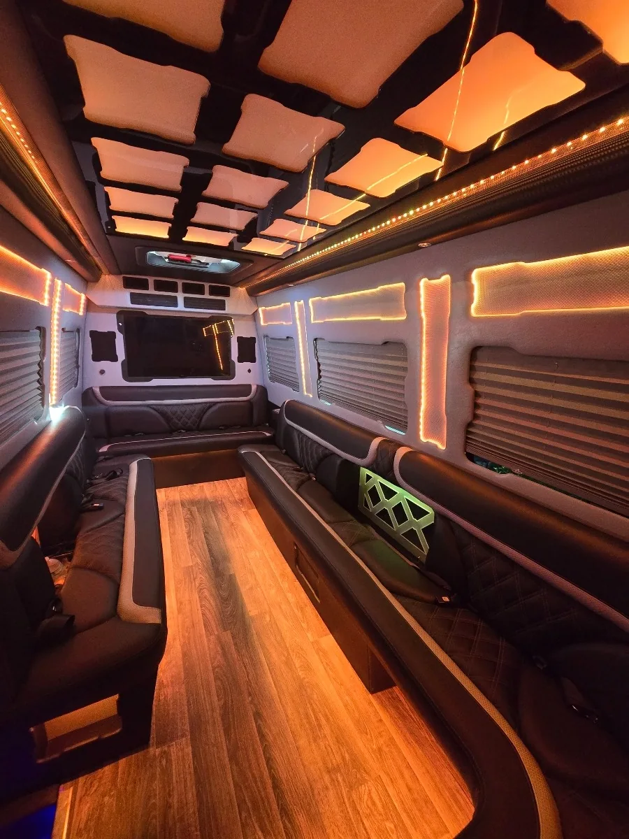Sprinter limo lounge seating with warm amber lighting