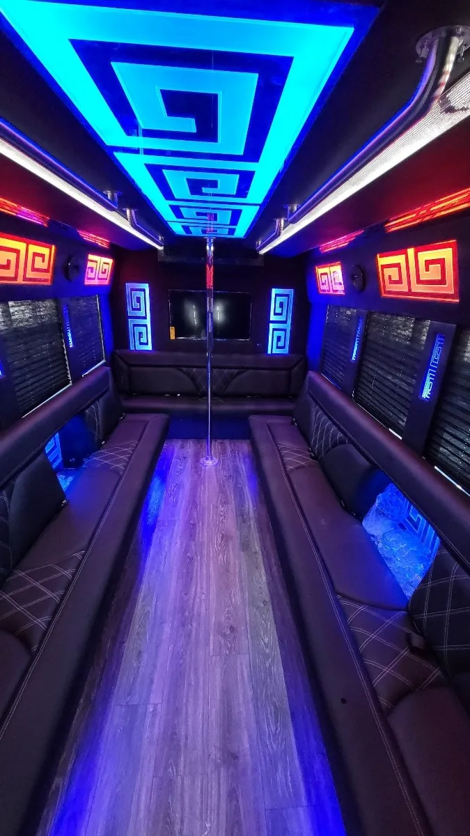 Party bus interior with blue ceiling and red accents