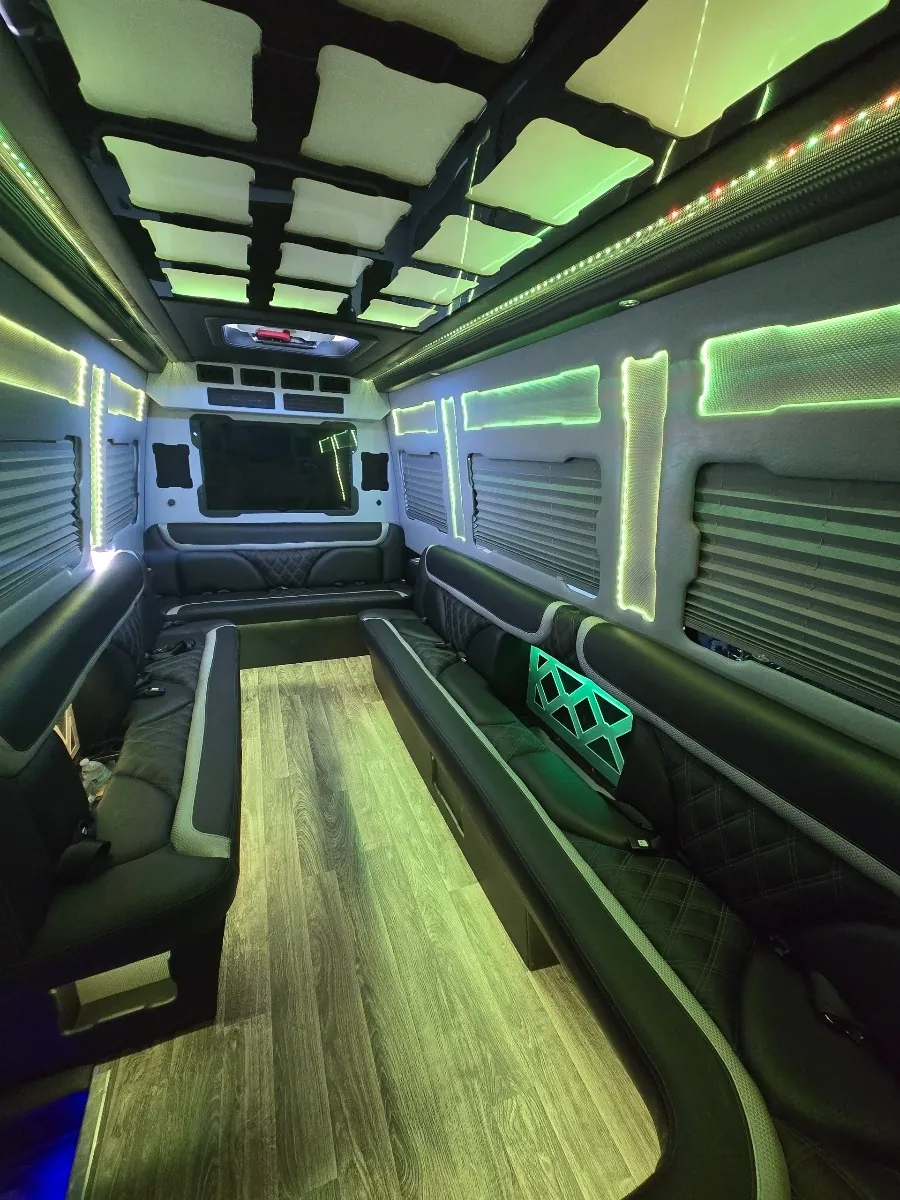 Sprinter limo lounge seating with green glow lighting