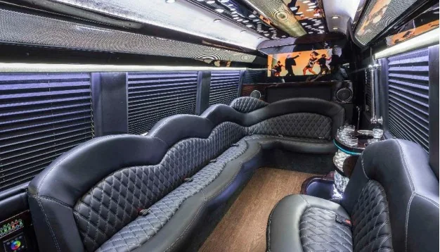 Black quilted Sprinter limo lounge seating and ceiling