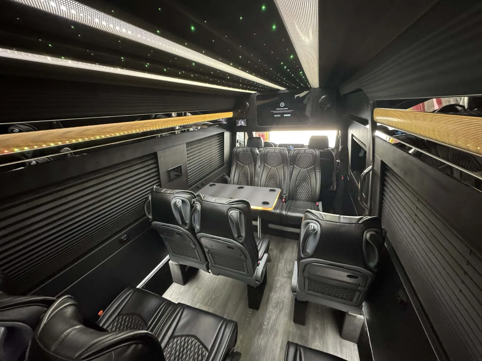 Sprinter limo executive interior with table and starlight ceiling