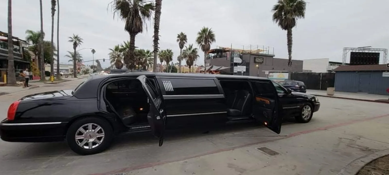 Black stretch limousine with both doors open