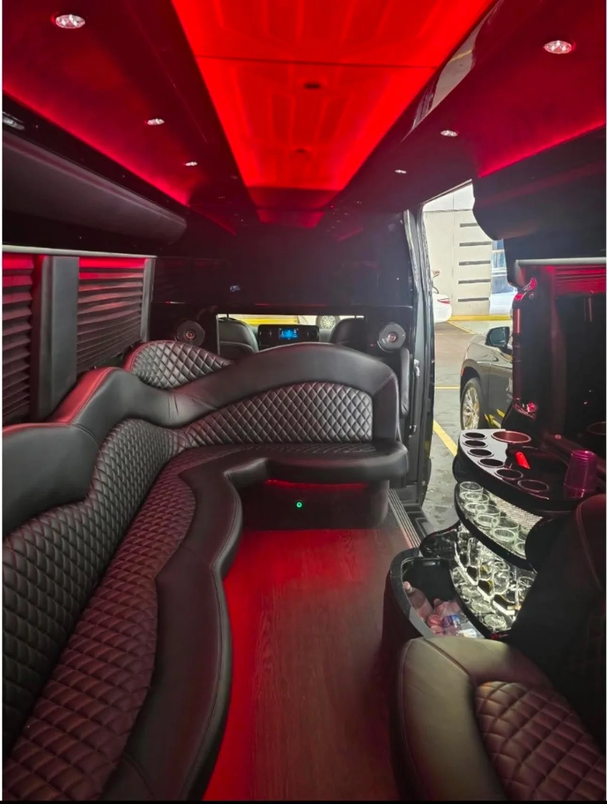 Quilted Sprinter limo seating viewed from the open door