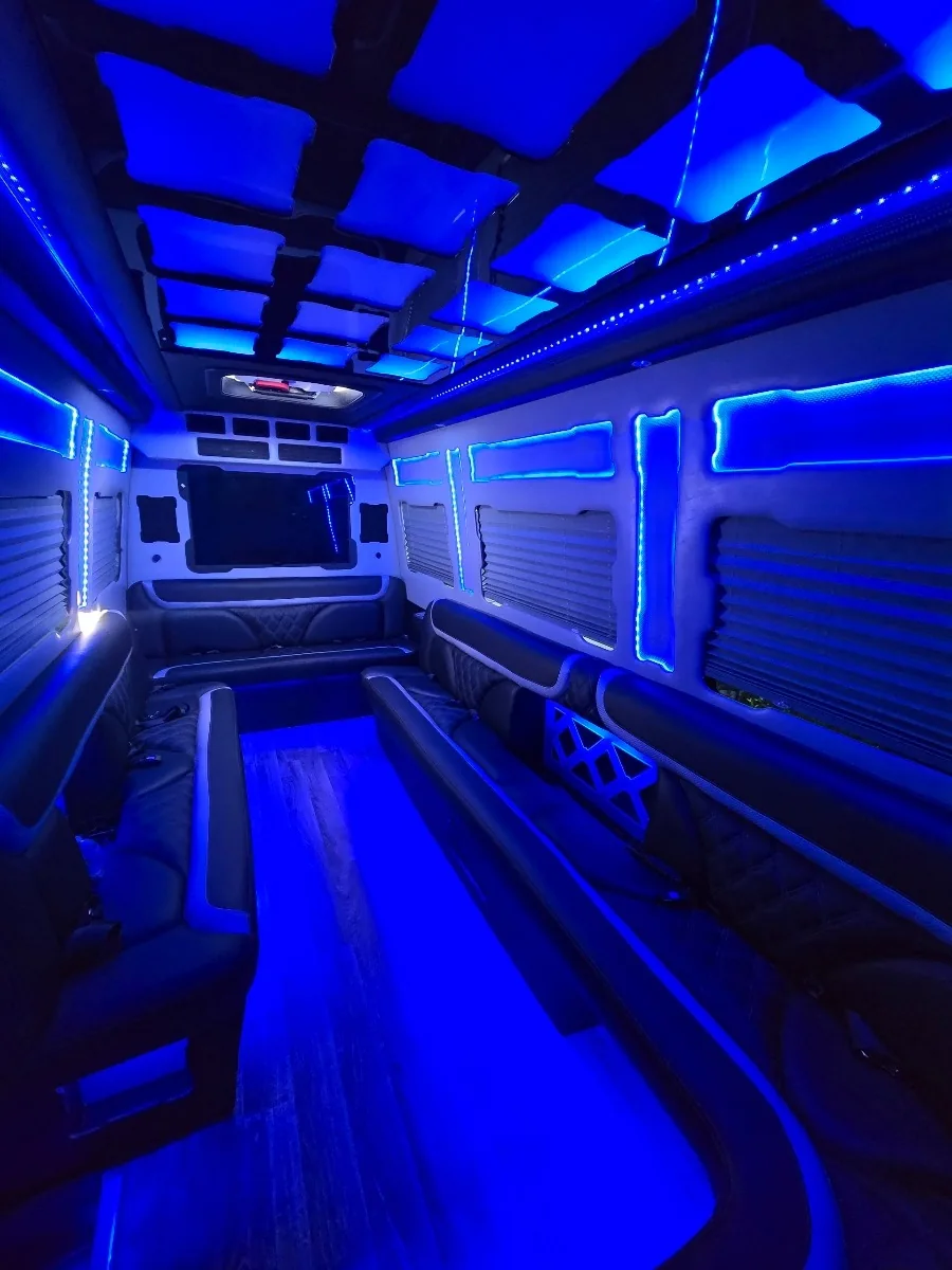 Black quilted Sprinter limo seating with blue accent lights