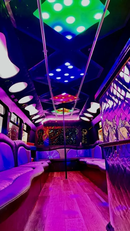 Party bus interior with dice-shaped ceiling lights in purple