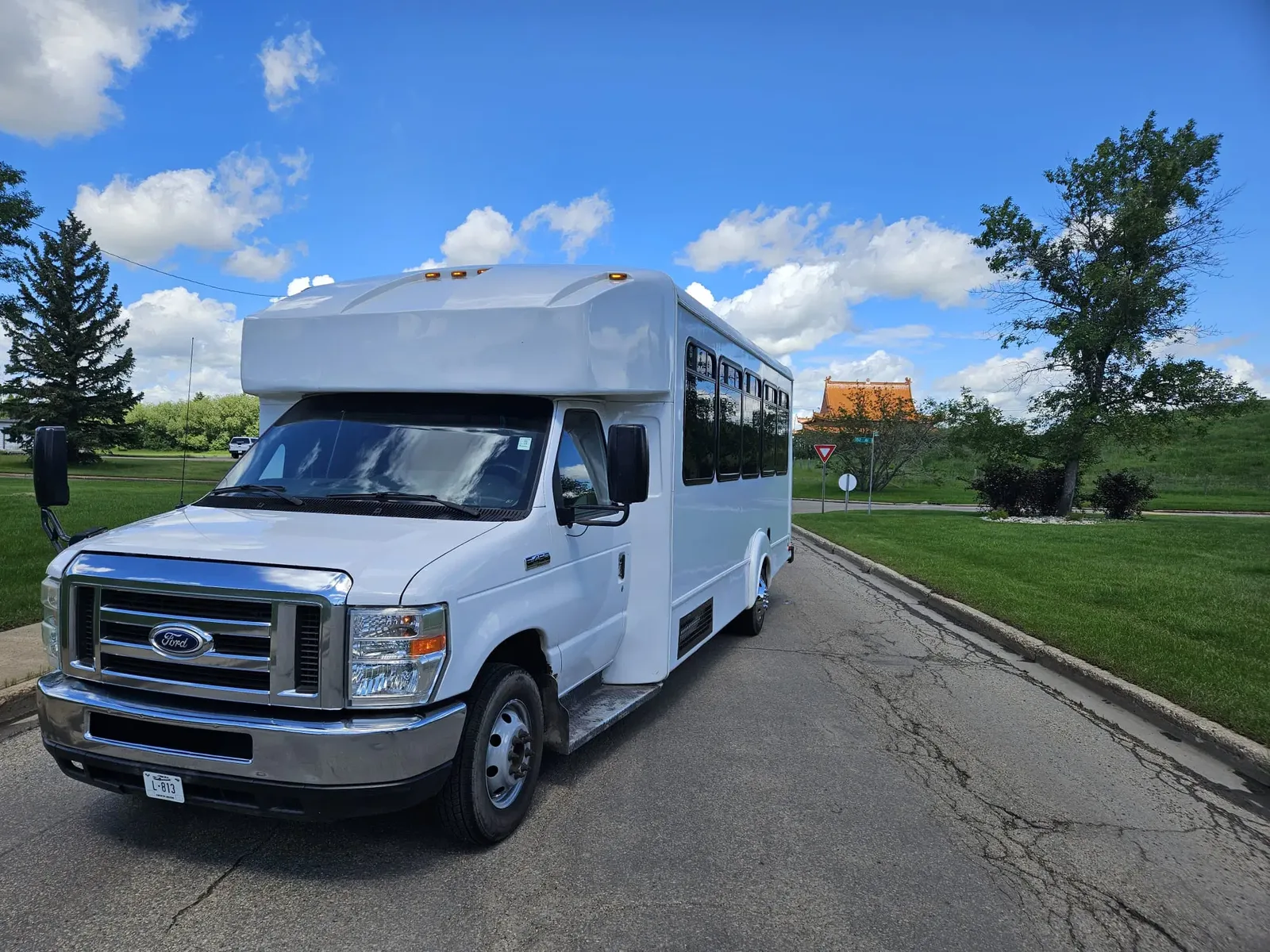 White Ford party bus front three-quarter view