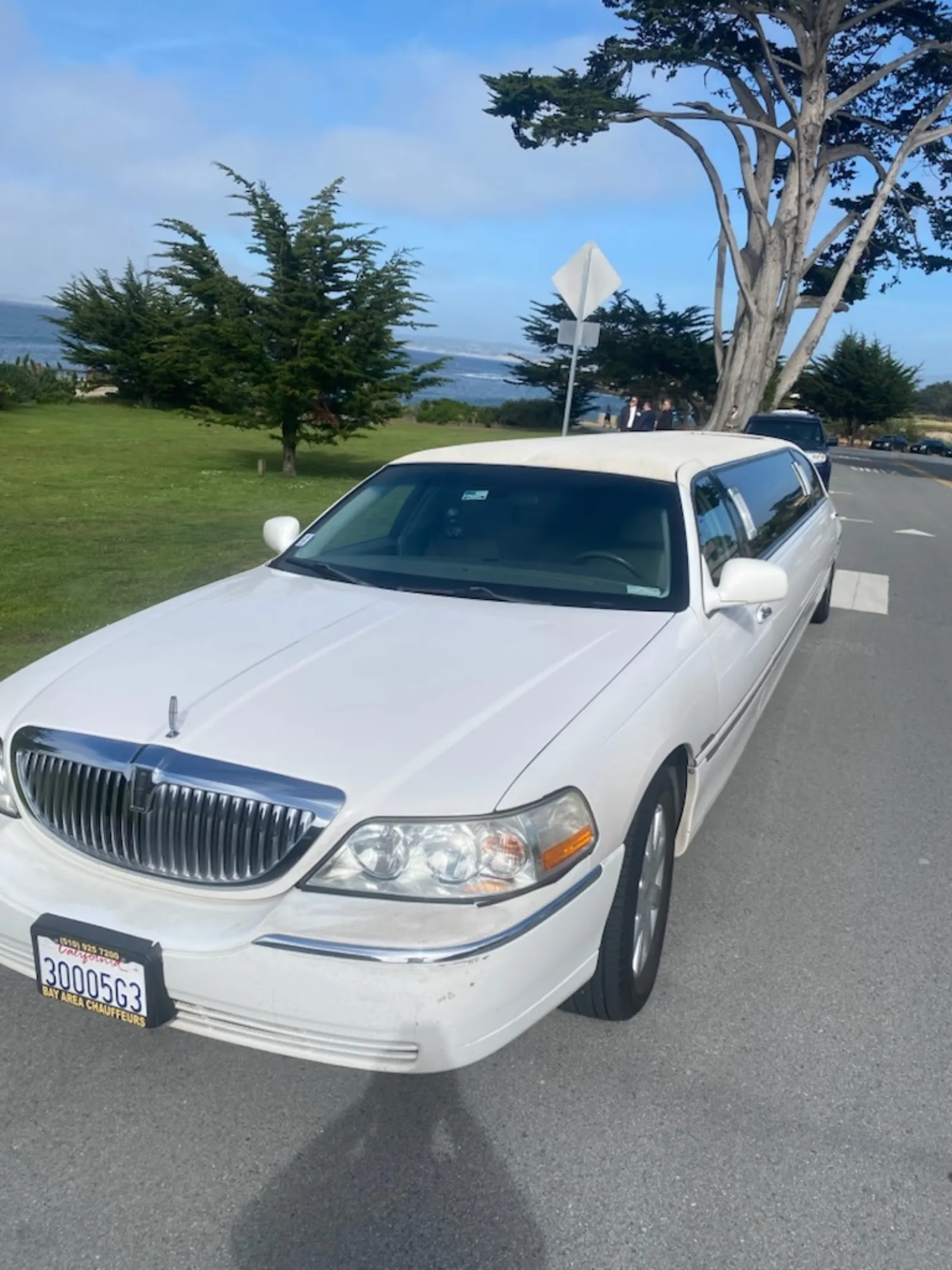 White Lincoln Town Car stretch limousine front view