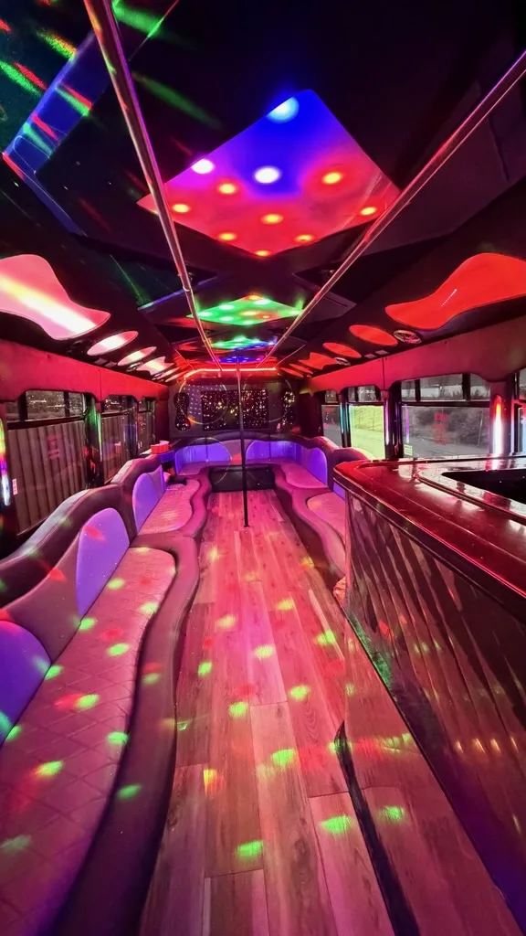 Party bus interior with bar and multicolor lighting