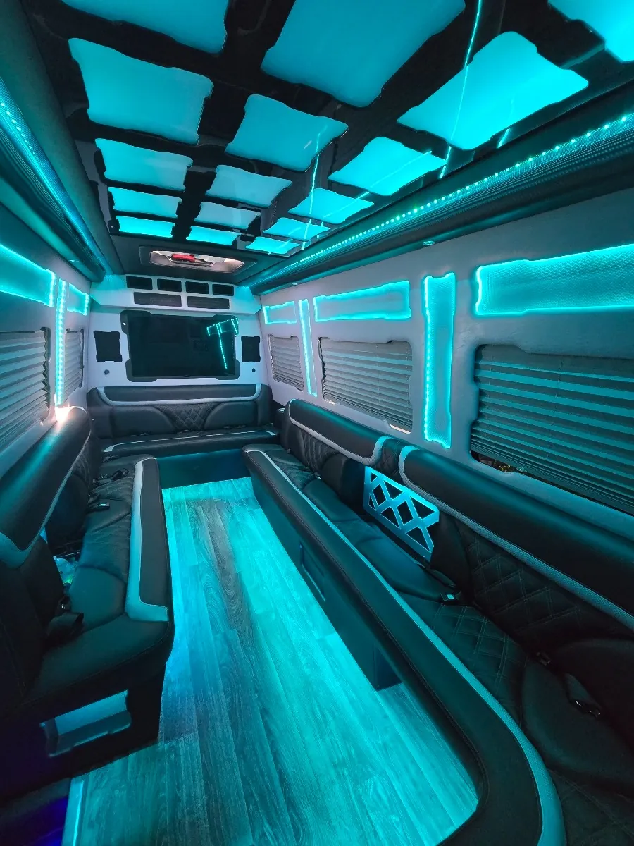 Sprinter limo lounge seating with teal glow lighting