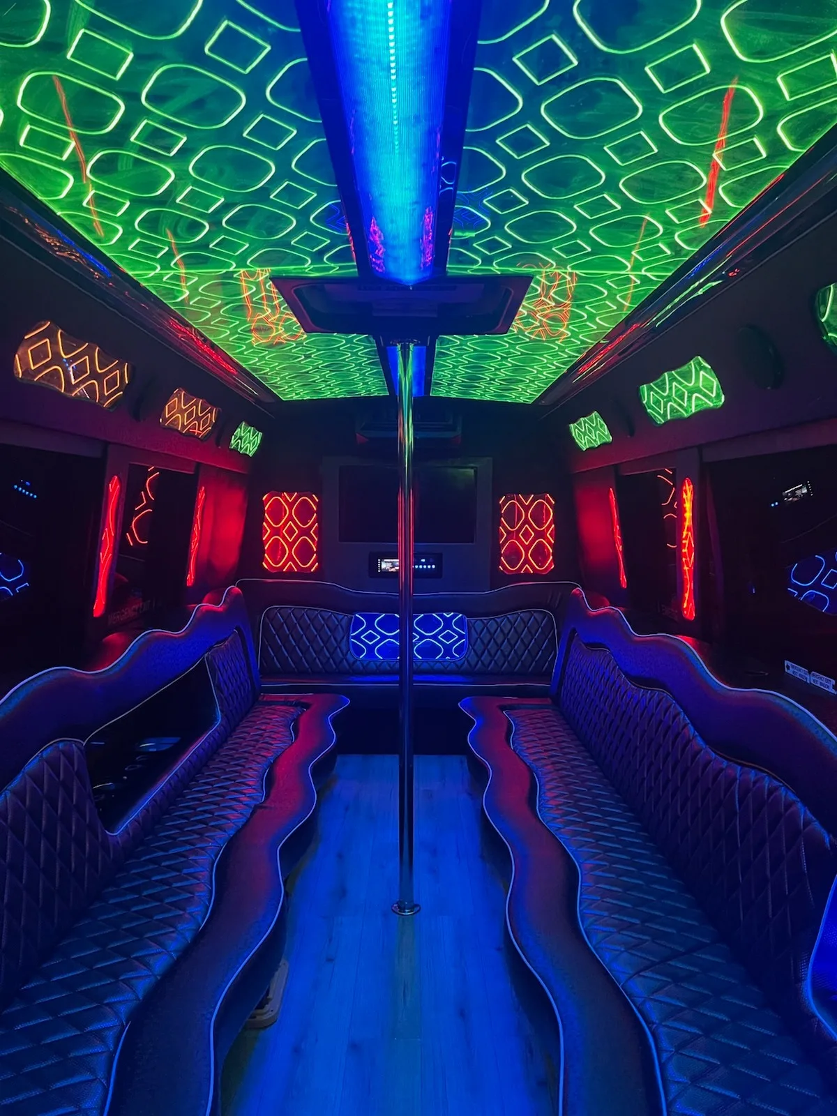 Party bus interior with green ceiling and red panels