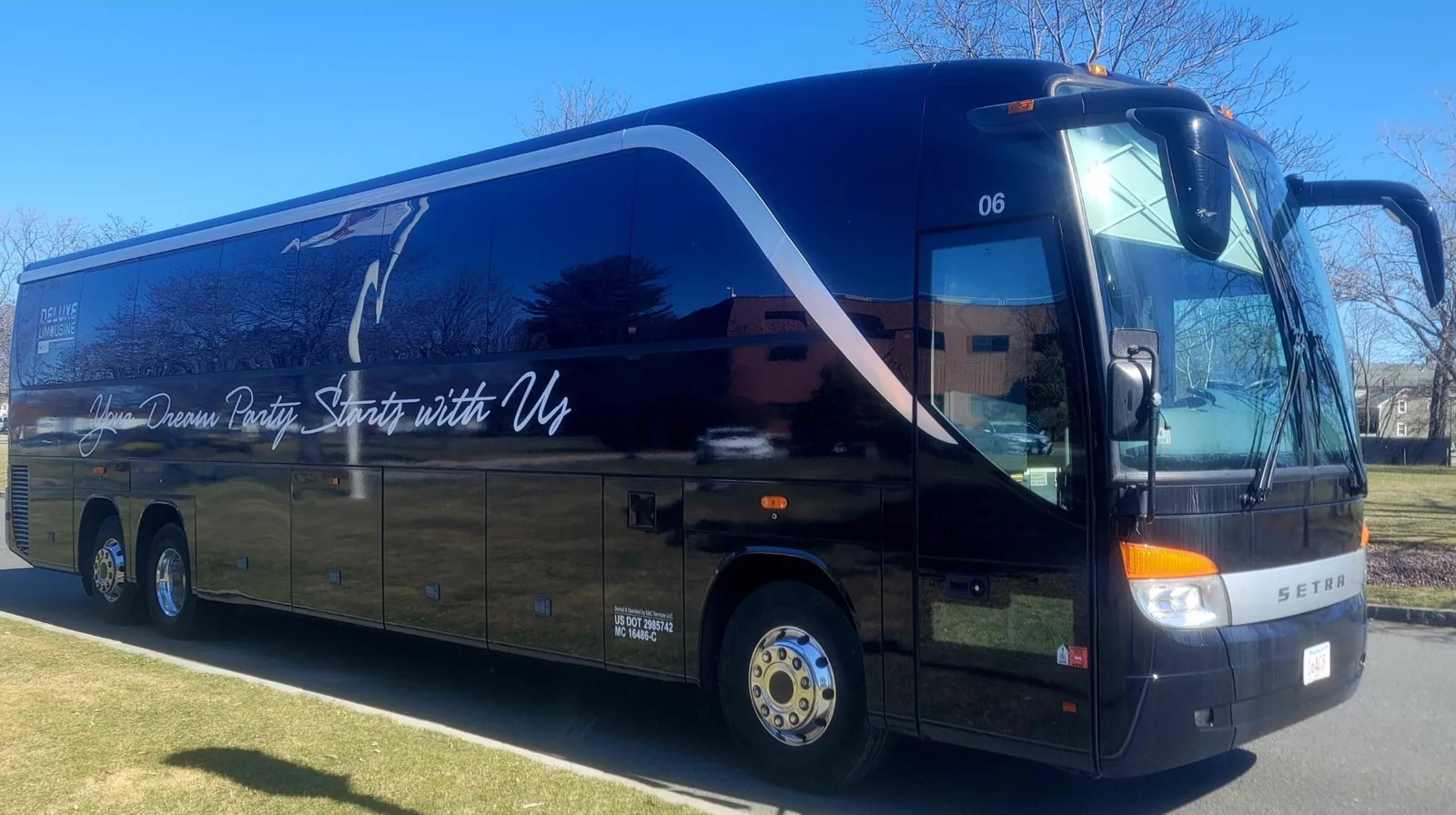 Black 50-passenger Setra party bus with Your Dream Party Starts with Us wrap