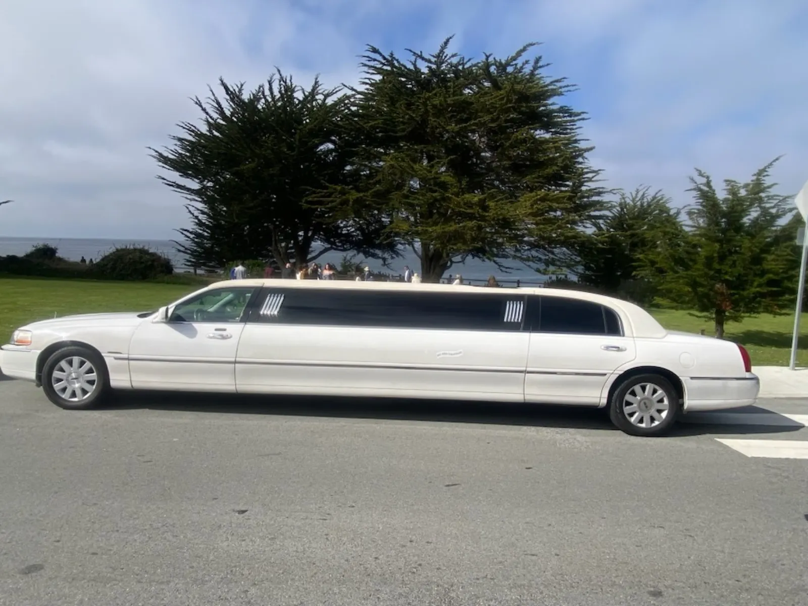 White stretch limousine parked by the coast